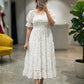 Embrace effortless romance with this ethereal maxi dress. Crafted from a lightweight, breezy fabric, this dress features a delicate ditsy floral print in soft lavender tones against a creamy off-white backdrop