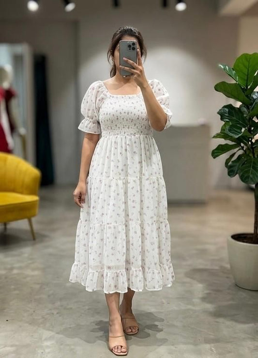Embrace effortless romance with this ethereal maxi dress. Crafted from a lightweight, breezy fabric, this dress features a delicate ditsy floral print in soft lavender tones against a creamy off-white backdrop