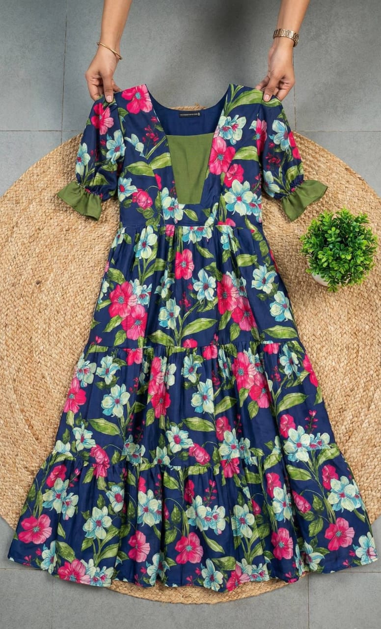 Ntroducing our latest  essential: the  Floral Dress. Crafted for comfort, this easy-breezy dress features a delightful  floral print. With a charming back knot detail and playful frill at the bottom, it’s perfect for sunny days