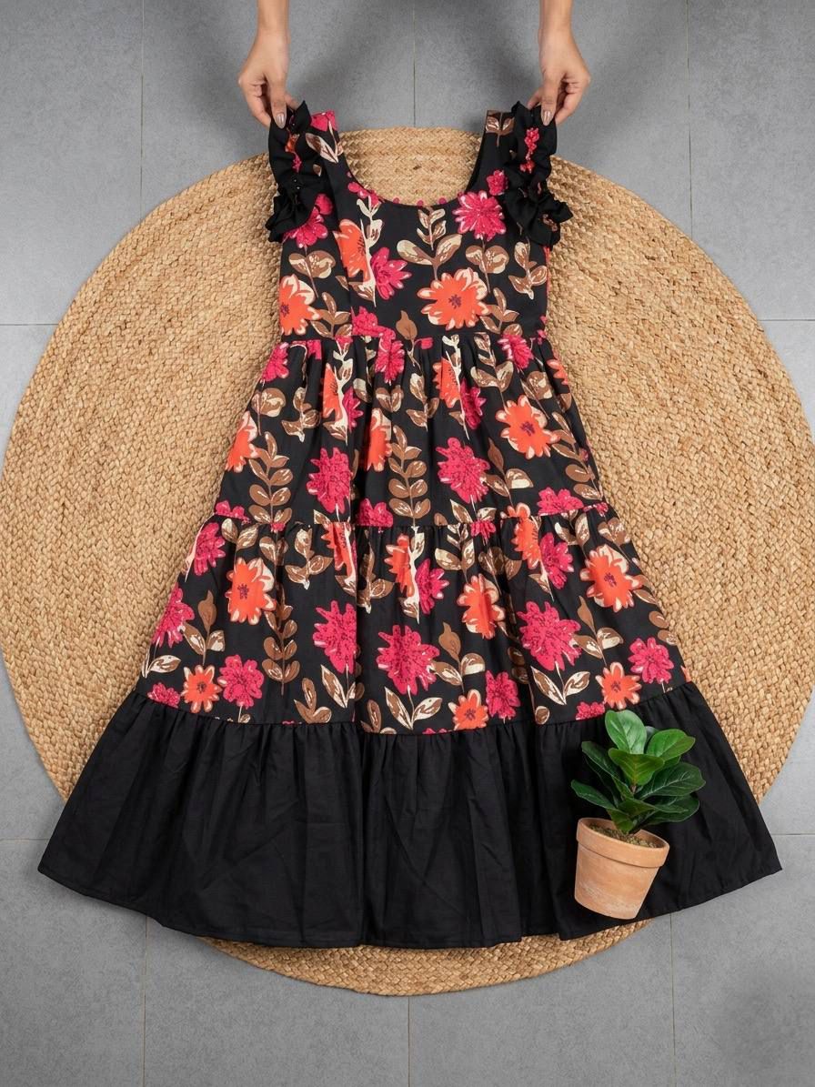 Ntroducing our latest  essential: the  Floral Dress. Crafted for comfort, this easy-breezy dress features a delightful  floral print. With a charming back knot detail and playful frill at the bottom, it’s perfect for sunny days