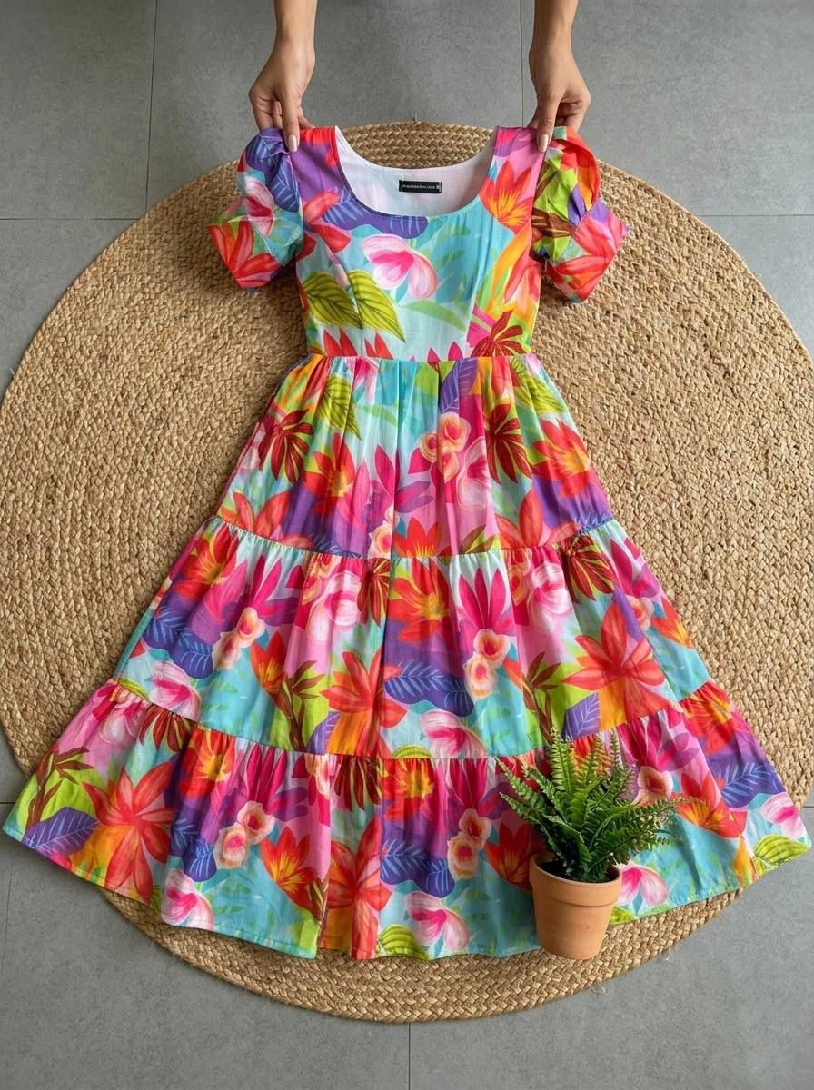 Ntroducing our latest  essential: the  Floral Dress. Crafted for comfort, this easy-breezy dress features a delightful  floral print. With a charming back knot detail and playful frill at the bottom, it’s perfect for sunny days